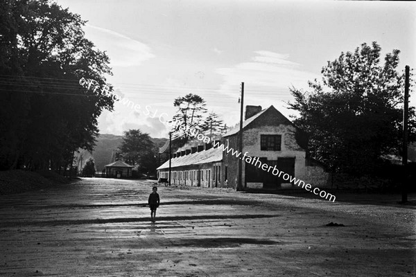 CHILD WALKING UP DESERTED STREET